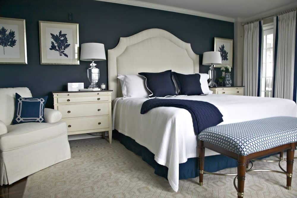 navy bedroom with white furniture